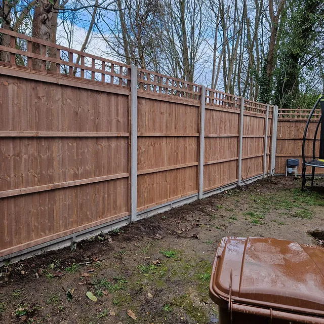 Domestic fence with trellis and concrete posts