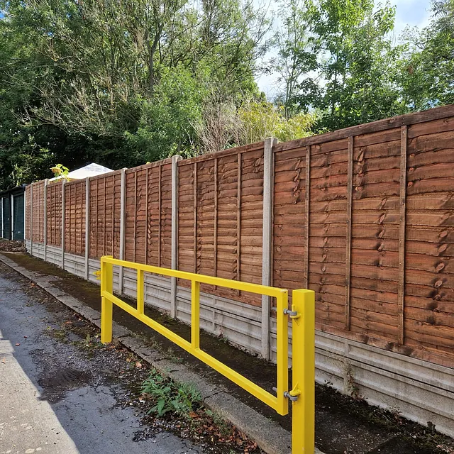 Garden fencing with concrete posts and base