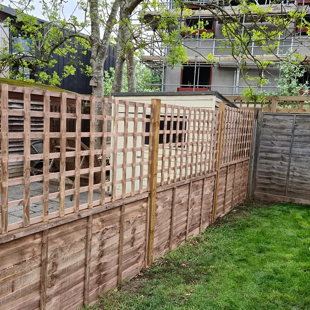 Small wooden fence with trellis